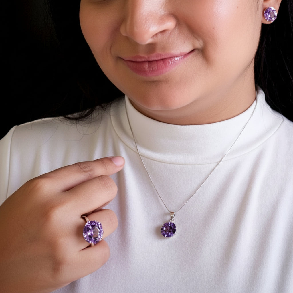 Woman wearing an Amethyst and 925 Sterling silver necklace, adjustable ring, and earrings.