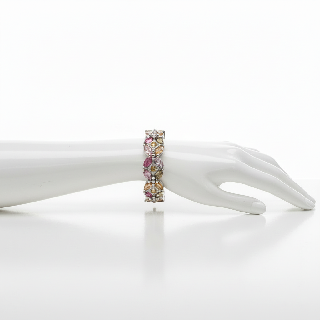 Multicolored gemstone bracelet on a white mannequin hand against a white background
