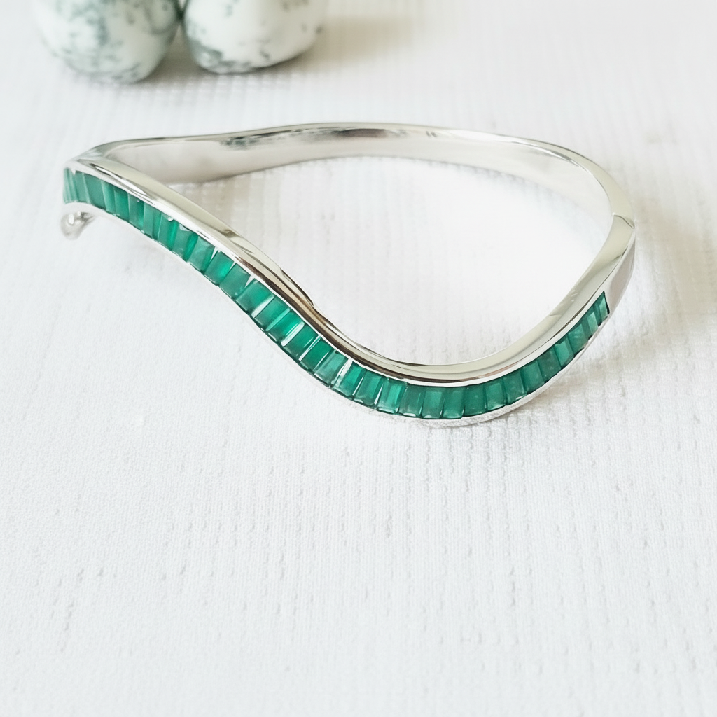 925 sterling silver Silver openable bangle with green onyx stones on a white background