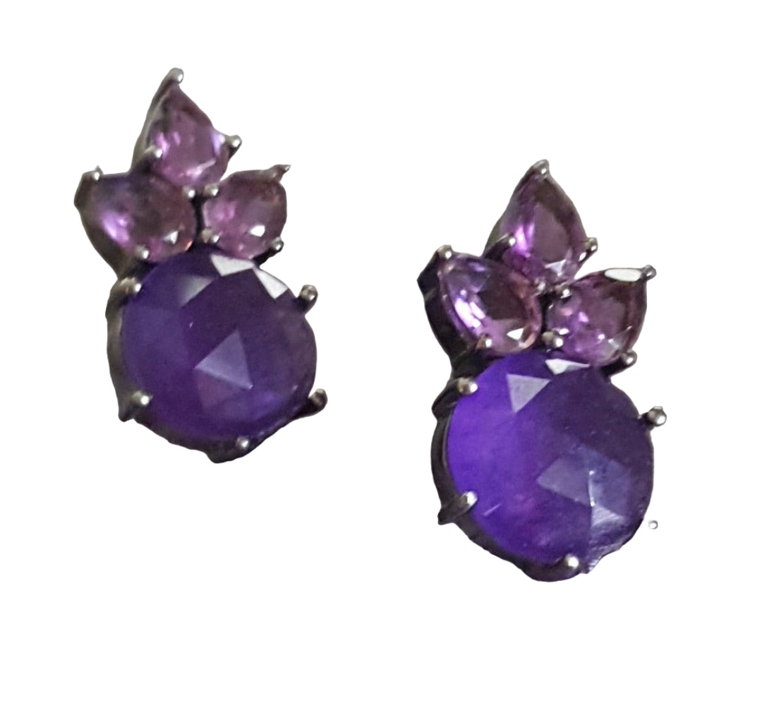 Oxidized silver earrings with amethyst and aventurine stones, showcasing their rich purple and green hues.