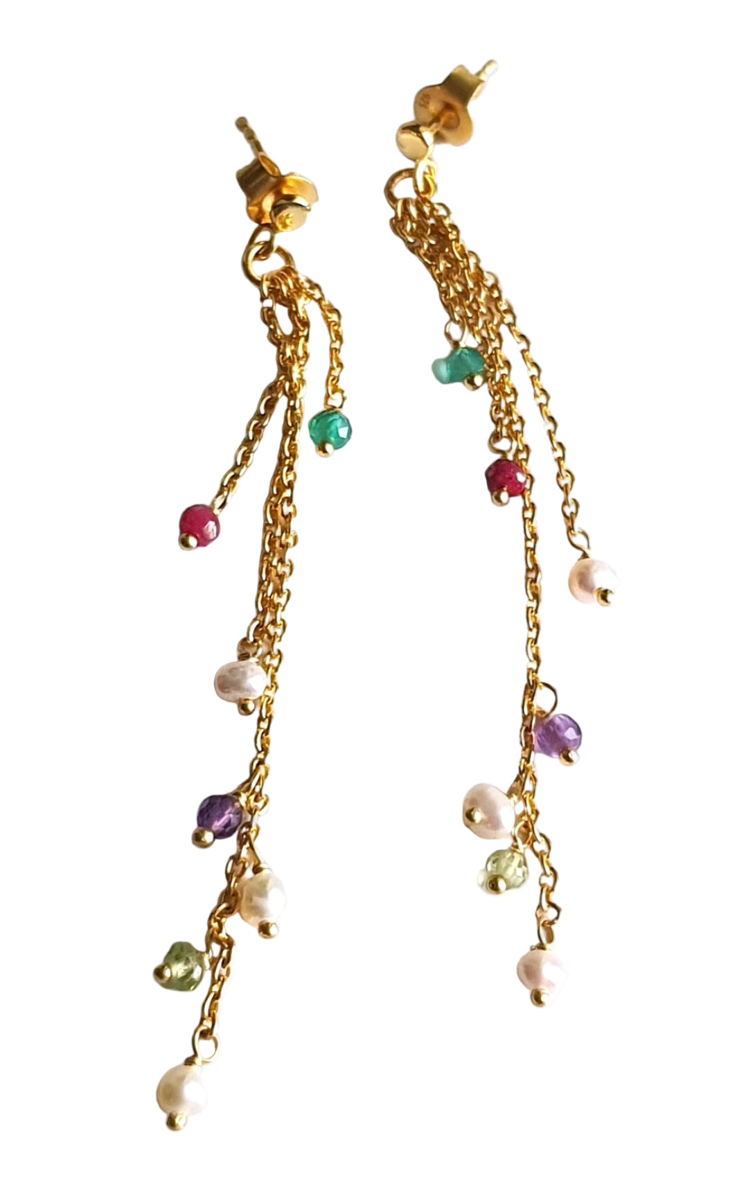 A pair of sterling silver earrings with gold finish, featuring an array of colorful gemstones including amethyst, peridot, pearl, ruby, and green onyx, dangling on a white background.