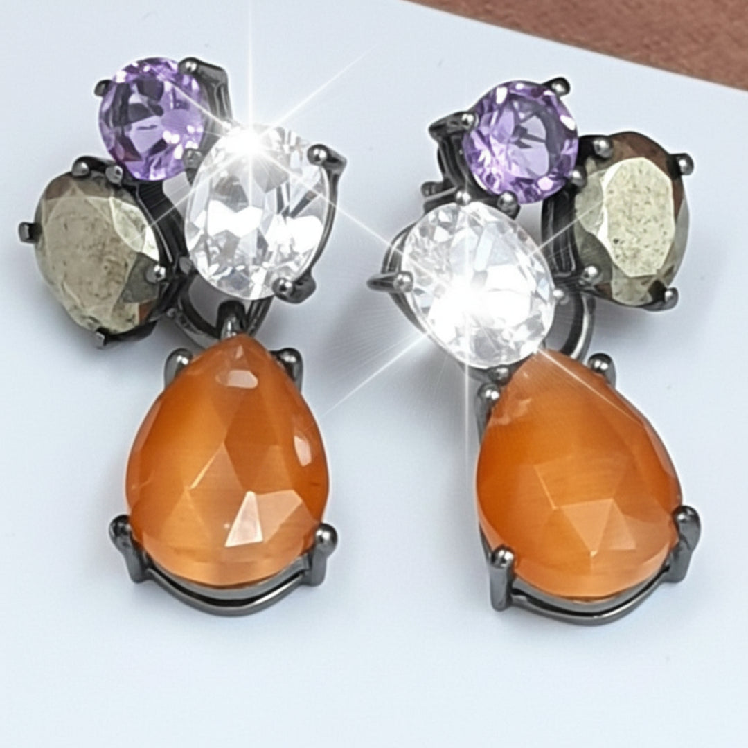 A pair of oxidized 925 sterling silver earrings with embedded gemstones, including amethyst, crystal quartz, pyrite, and peach moonstone.