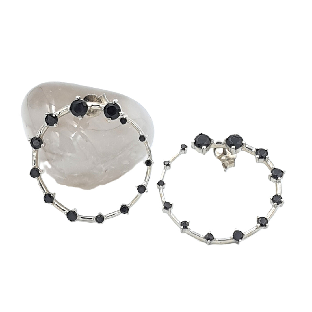 Black onyx front-facing hoop earrings in rhodium-finished 92.5 sterling silver, offering a modern twist on classic hoops.