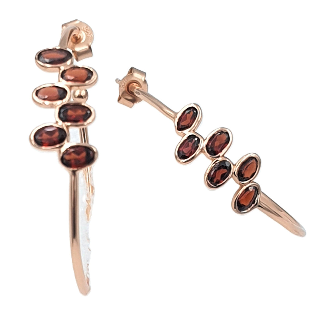 Garnet gemstone hoop earrings in rose-gold plated 92.5 sterling silver, featuring an elegant and romantic design.
