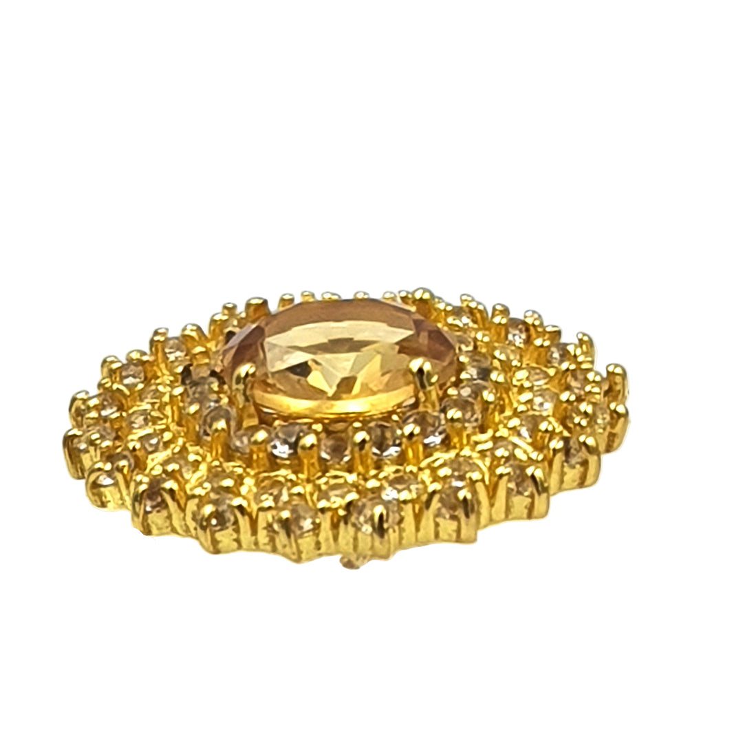 Side view of gold-plated 92.5 sterling silver earrings with citrine and white topaz stones, highlighting the dimensional sunburst motif.