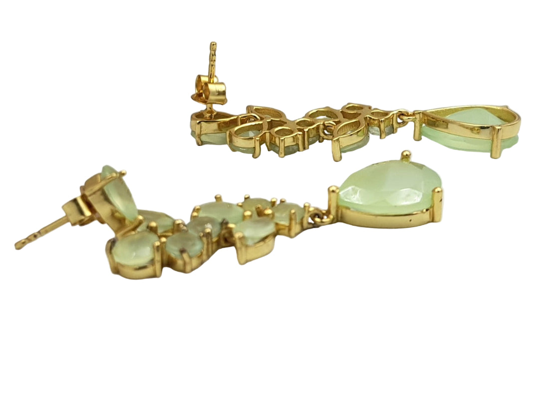 Side view of gold-plated earrings with prehnite chalcedony stones, highlighting the smooth contours and natural green glow.