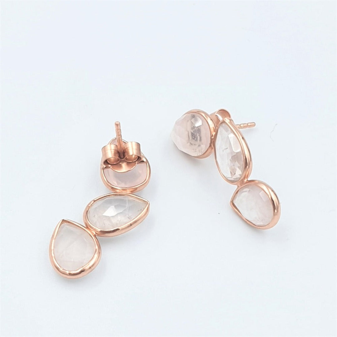 Side view of rose quartz earrings in rose-gold plated 92.5 sterling silver, highlighting their slim, petal-like silhouette.