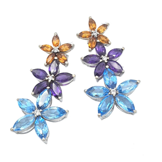 A pair of sterling silver earrings, adorned with citrine, amethyst, and blue topaz stones, with a rhodium finish.