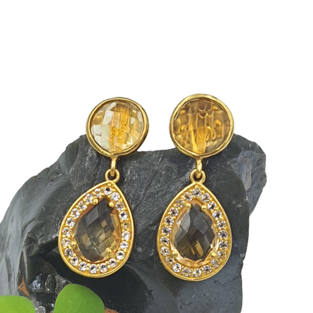 Close-up of citrine and white topaz earrings in yellow-gold plated 92.5 sterling silver, showcasing the vibrant yellow sparkle and fine detailing.