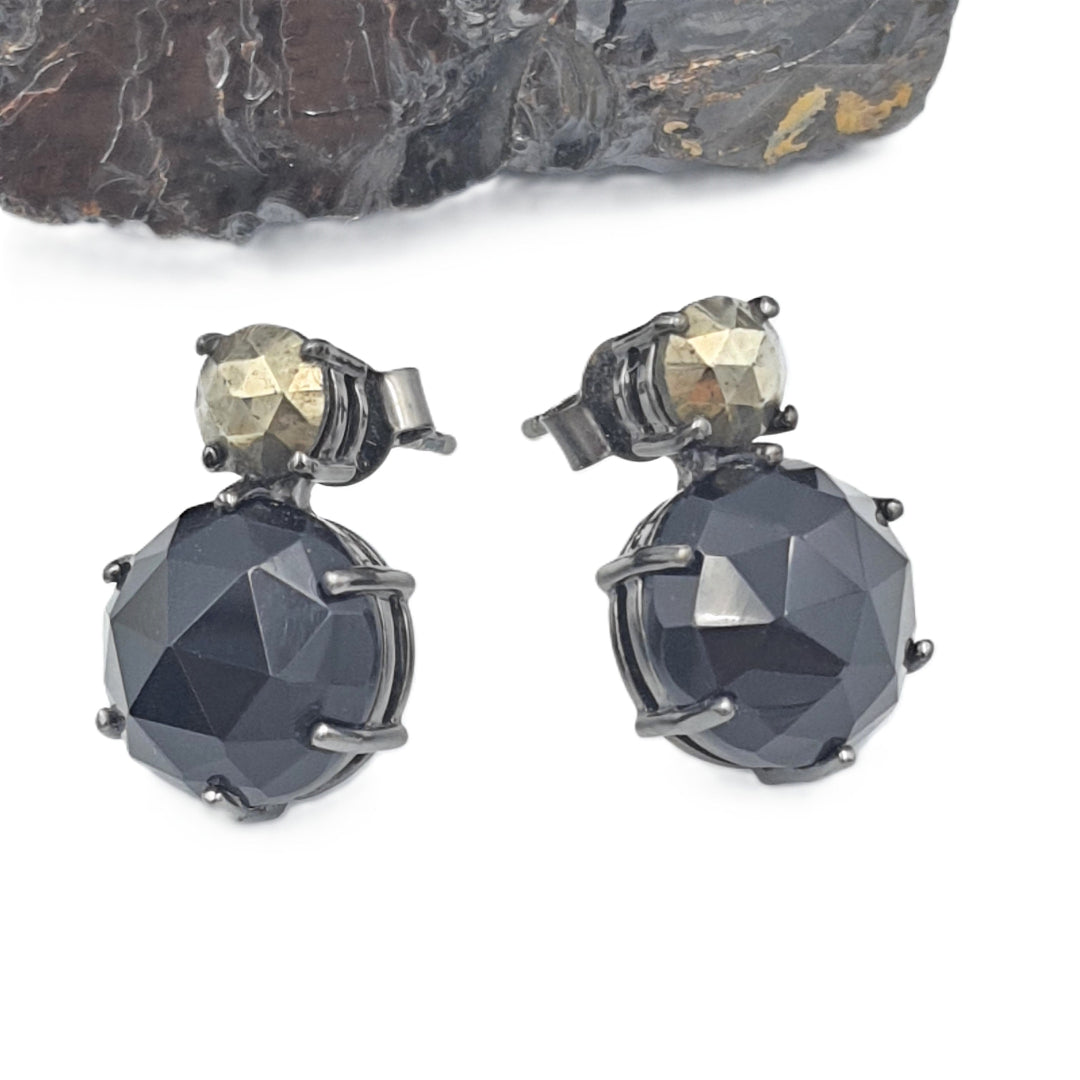 Side view of pyrite and black onyx earrings in black oxidized silver, highlighting their bold evening-wear look.