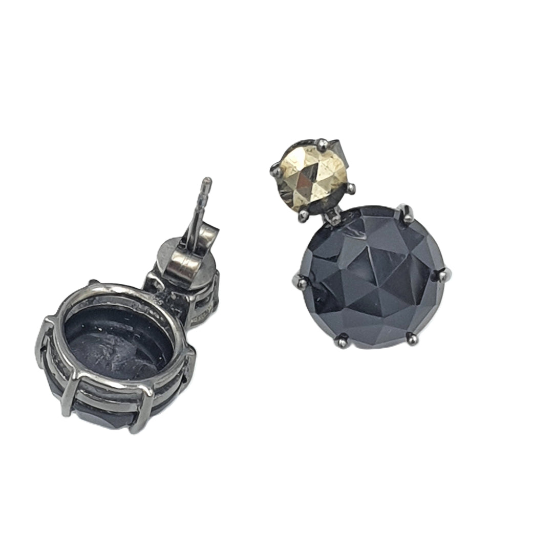 Detailed shot of oxidized black silver earrings with pyrite and black onyx gemstones, designed for a sophisticated dinner-date style.