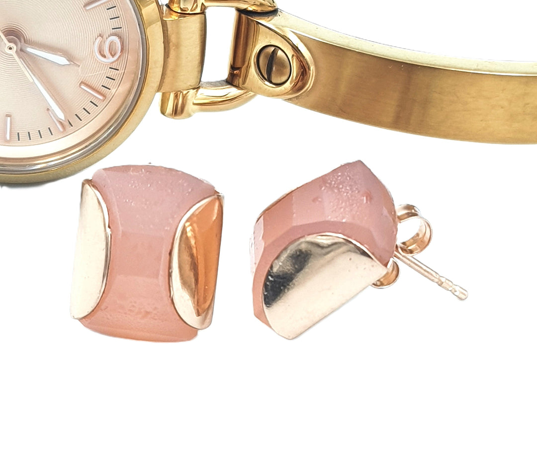 Side view of rose chalcedony stud earrings in rose-gold plated 92.5 sterling silver, highlighting their smooth, structured form.