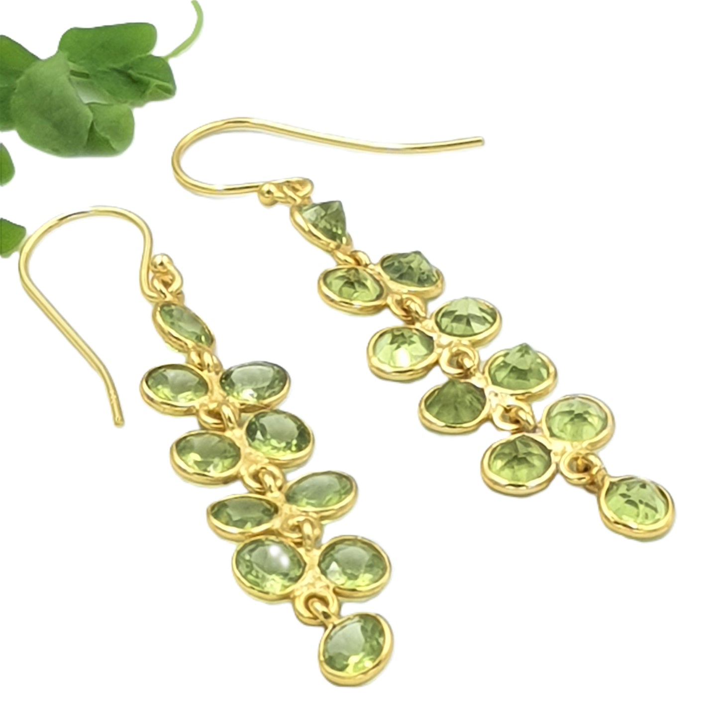 Elegant peridot gemstone earrings crafted in 925 sterling silver with yellow-gold plating, inspired by delicate green wisteria flowers.