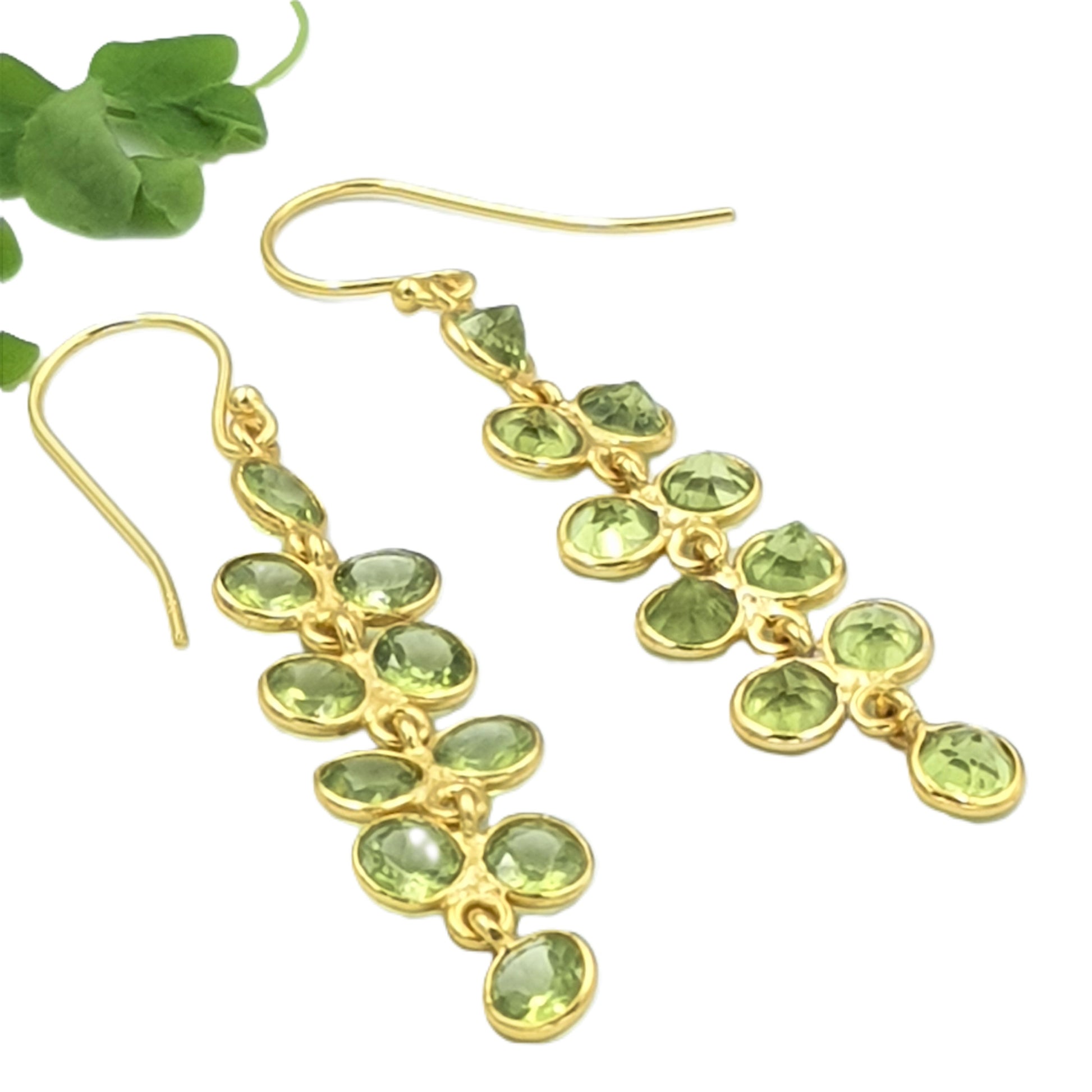 Elegant peridot gemstone earrings crafted in 925 sterling silver with yellow-gold plating, inspired by delicate green wisteria flowers.