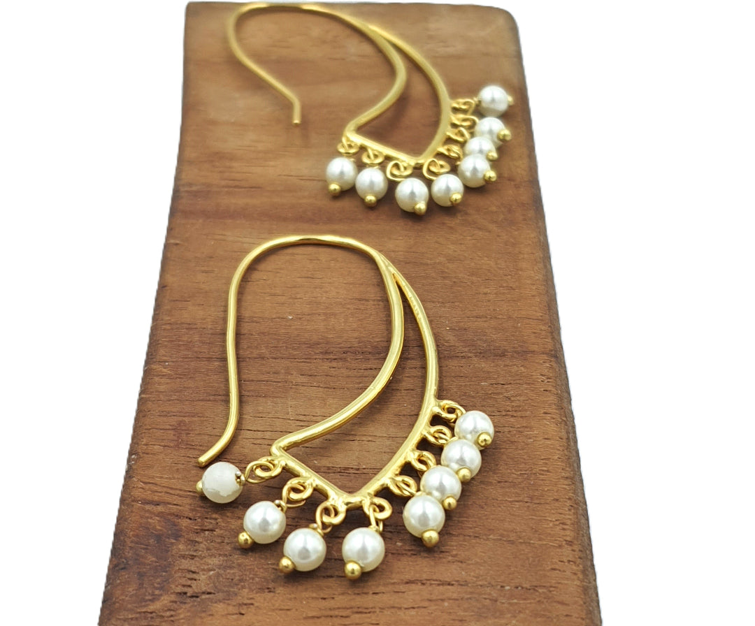 Gold-plated 92.5 sterling silver swan earrings with dangling pearls, showcasing their whimsical everyday style.