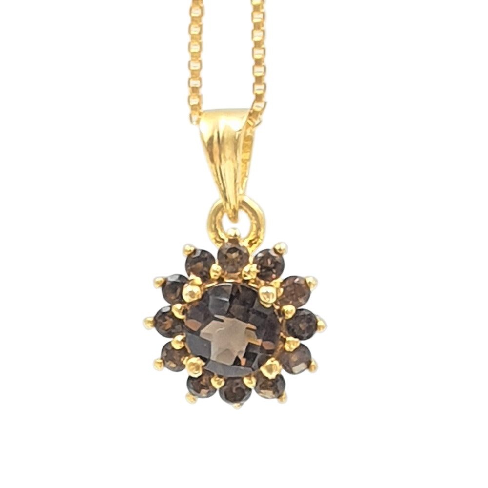 A gold-plated sterling silver pendant with smoky topaz gemstones, presented on a box chain.