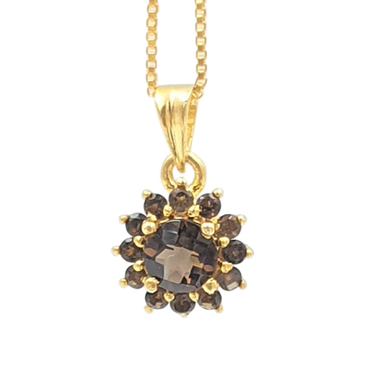 A gold-plated sterling silver pendant with smoky topaz gemstones, presented on a box chain.