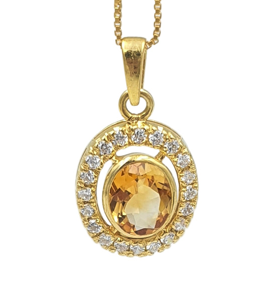 Close-up of citrine and cubic zirconia pendant in gold-plated 92.5 sterling silver, highlighting the bright sun-inspired design.