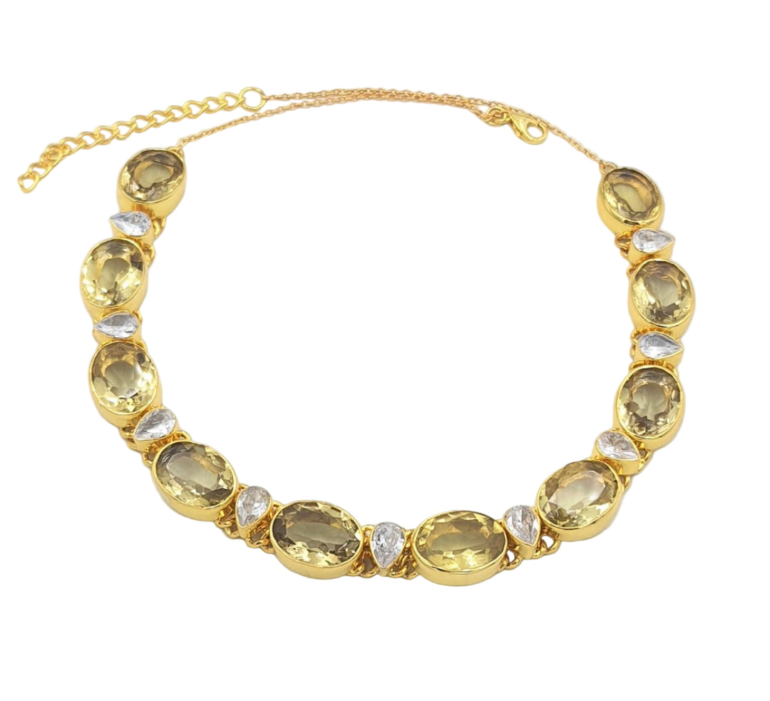 Gold-plated 92.5 sterling silver necklace with lemon topaz and cubic zirconia stones, showcasing its elegant, timeless style.