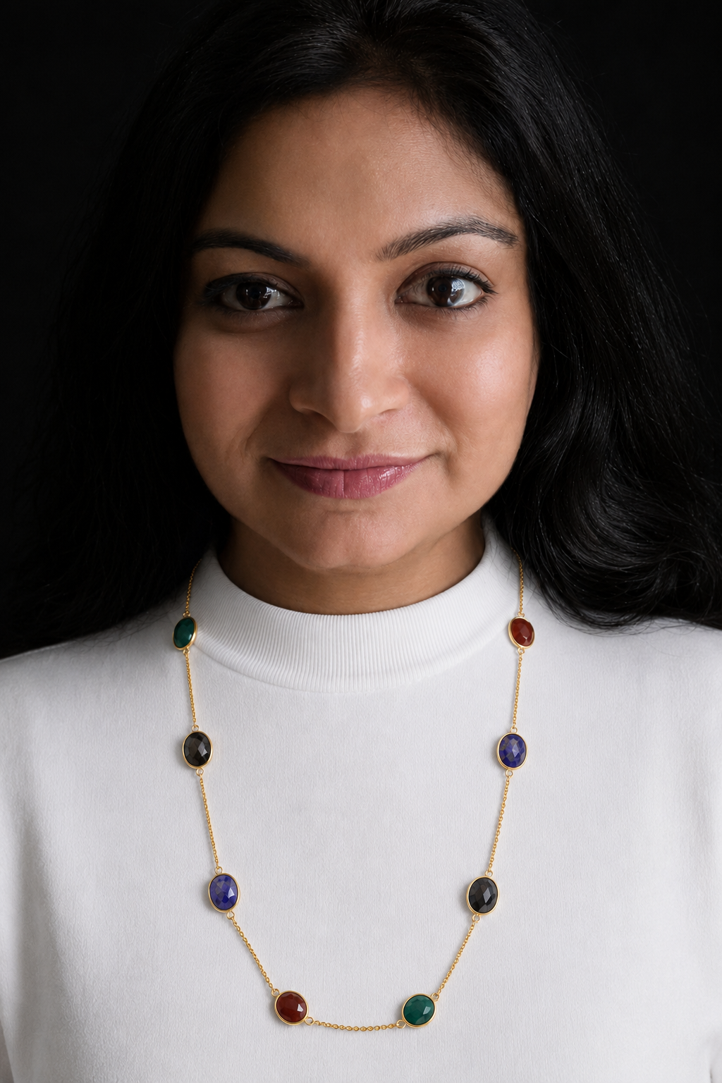 Green Onyx, Red Onyx, Black Onyx and Lapis Lazuli 92.5 sterling silver necklace with gold finish, 18 inches, shown on model in white top.