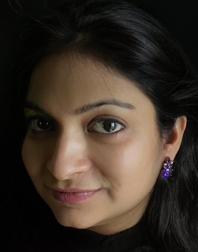 Amethyst and aventurine earrings in oxidized 92.5 sterling silver worn by a woman, showing their elegant, sophisticated look when styled.