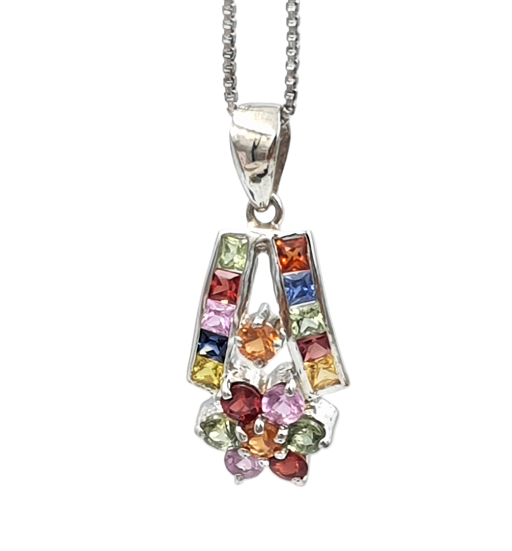 Close-up of multi sapphire pendant in rhodium-finished 92.5 sterling silver, highlighting the vibrant mix of colorful gemstones.