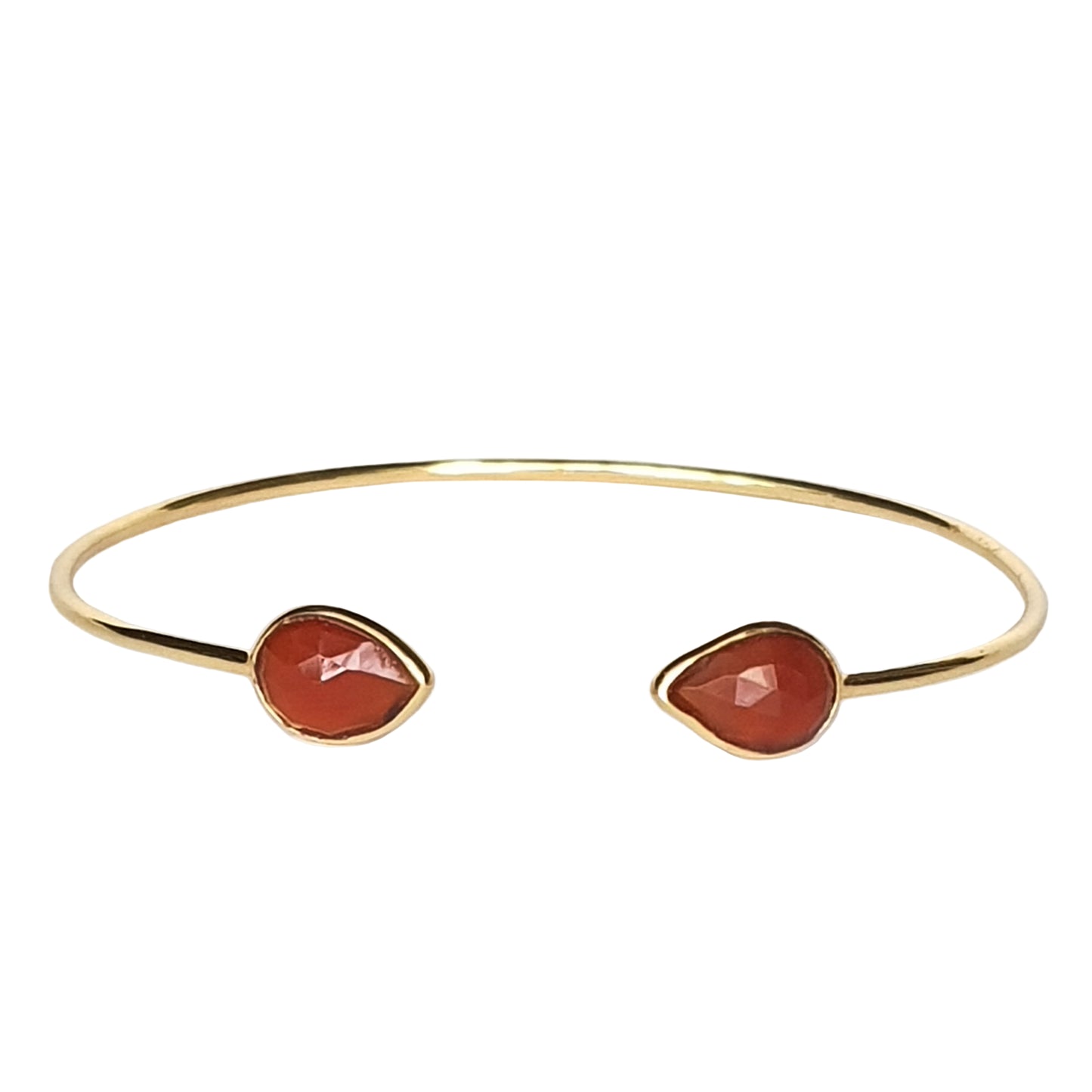 A gold-plated 925 sterling silver cuff bracelet with two orange onyx stone accents on a white background.