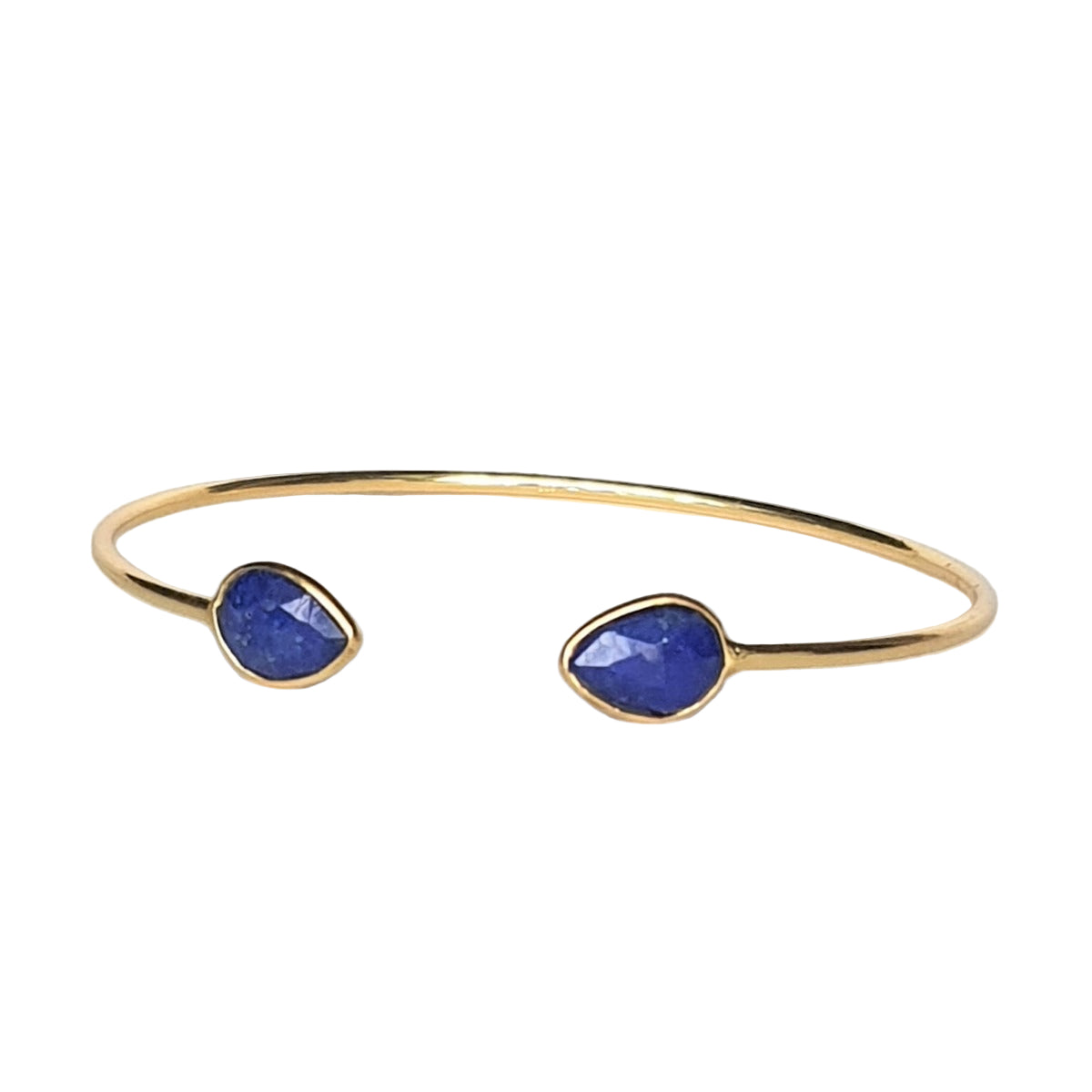 A gold-plated 925 sterling silver cuff bracelet featuring two blue onyx gemstones on opposite ends.