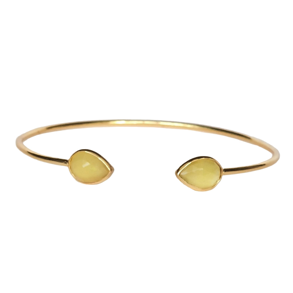 A gold-plated 925 sterling silver cuff bracelet featuring two yellow chalcedony stones on opposite ends.