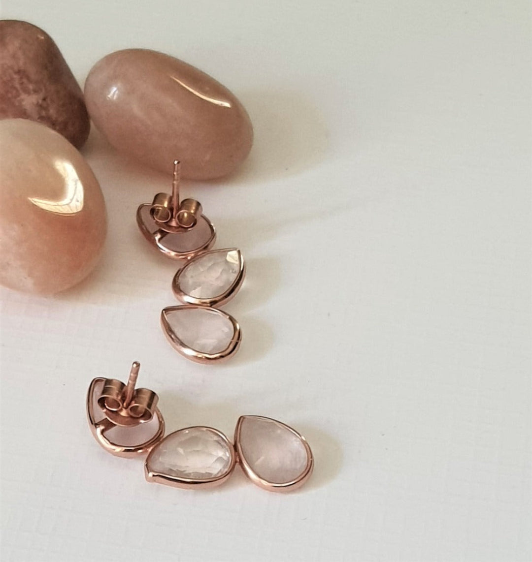 Back view of rose quartz earrings in rose-gold plated 92.5 sterling silver, showing the polished finish and backing.