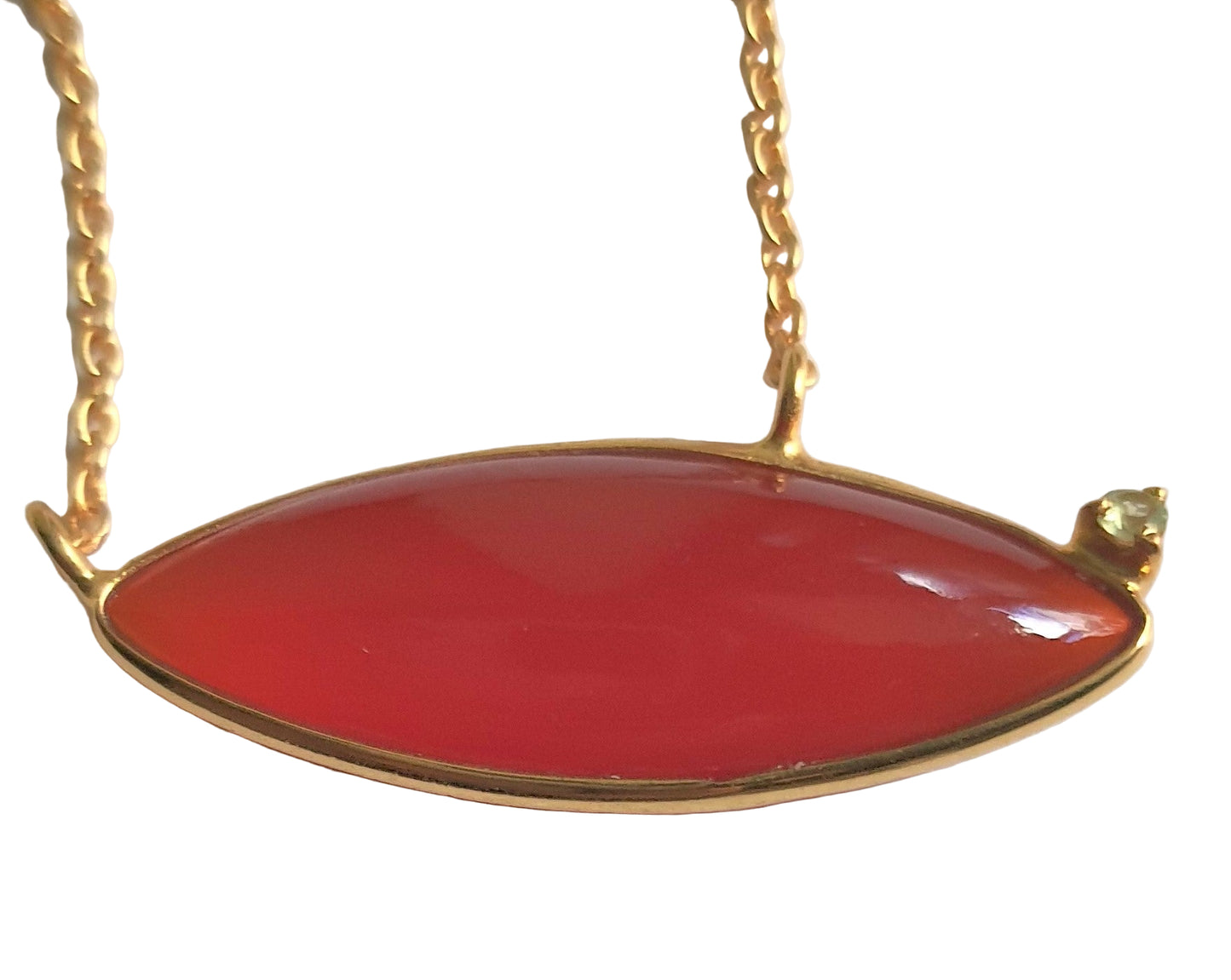 Close-up of red onyx and peridot pendant in gold-plated 92.5 sterling silver, highlighting the tilted-petal design and vibrant colors.