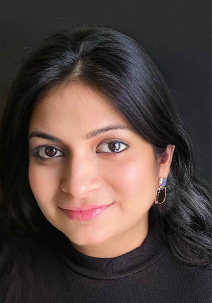 Smoky quartz and labradorite earrings in gold-plated 92.5 sterling silver worn by a woman, showing their elegant earth-and-sky inspired look when styled.