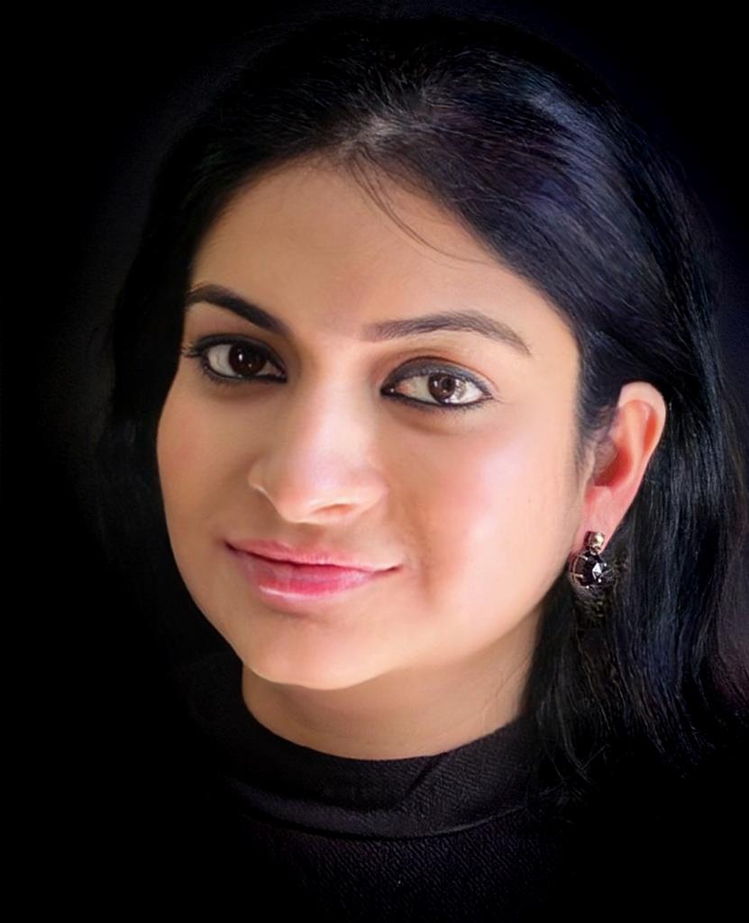 Pyrite and black onyx gemstone earrings in black oxidized silver worn by a woman, showing how the elegant design looks when styled.