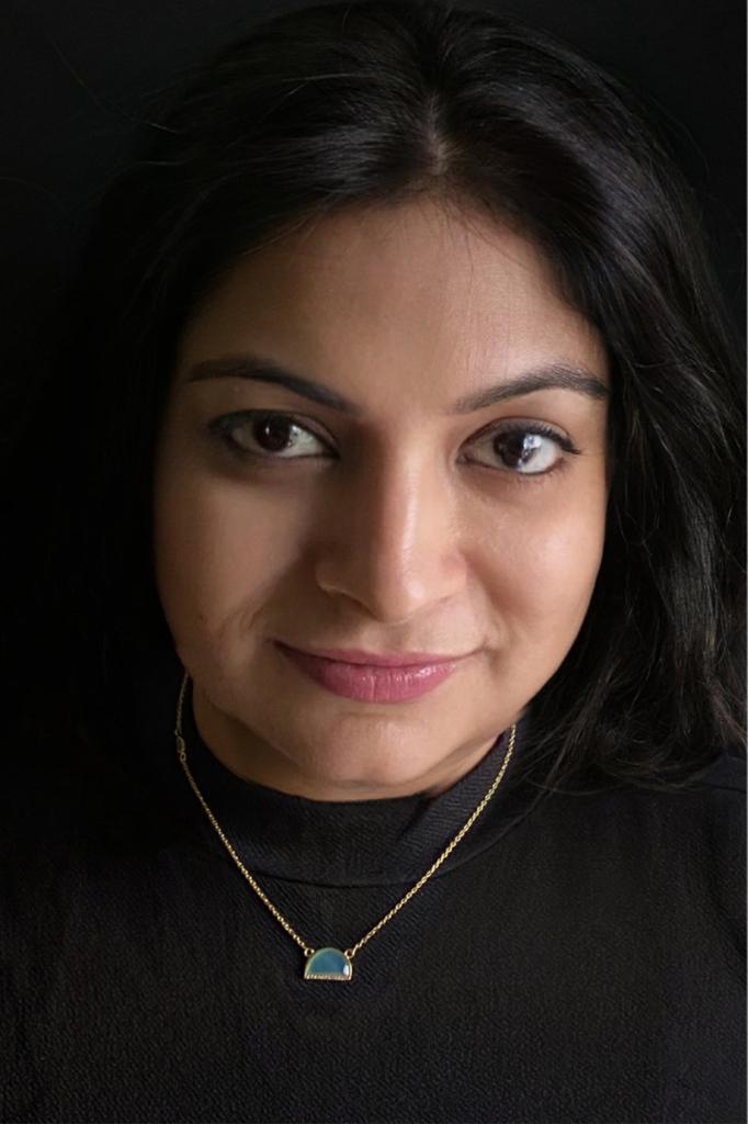 Aqua chalcedony and cubic zirconia necklace in gold-plated 92.5 sterling silver worn by a woman, showing its soft blue elegance and modern look when styled.